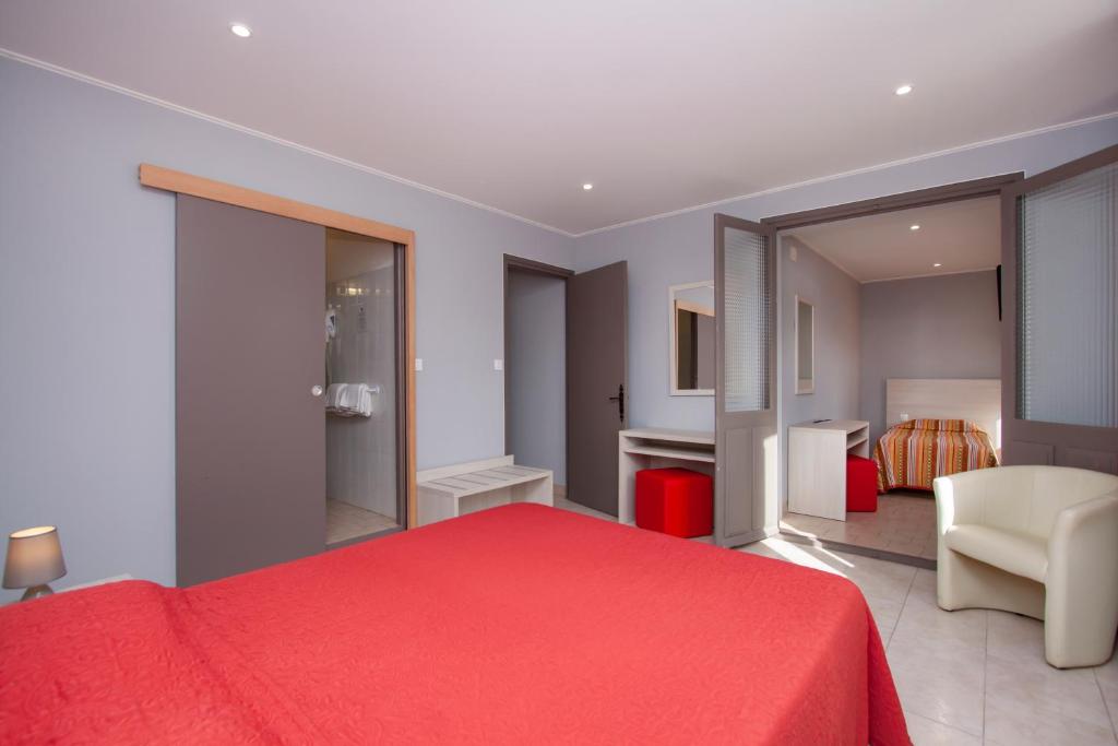 Postel nebo postele na pokoji v ubytování Hotel Arcu Di Sole
