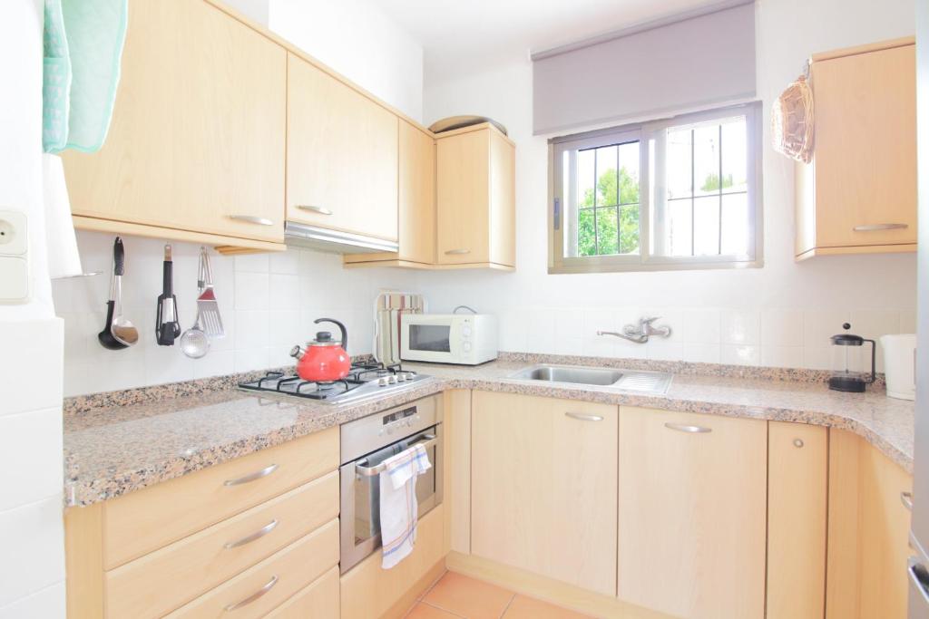 A kitchen or kitchenette at Villa Santa Lucia - 0204