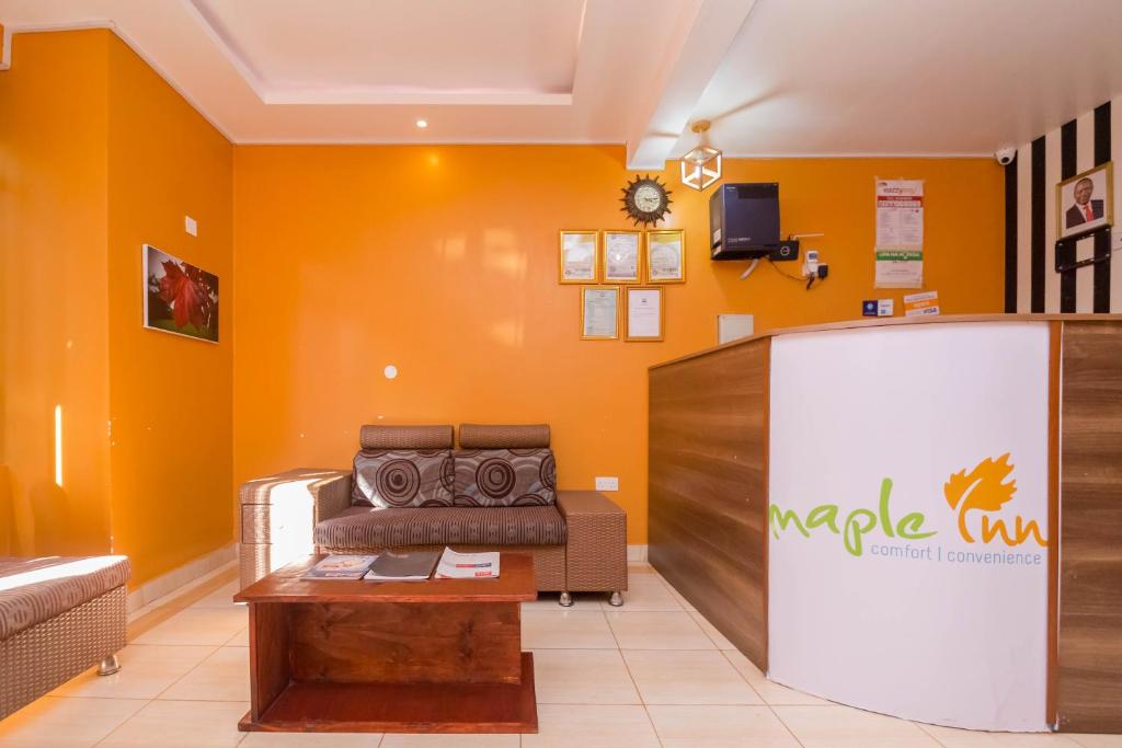TV a/nebo společenská místnost v ubytování Maple Inn Hotel