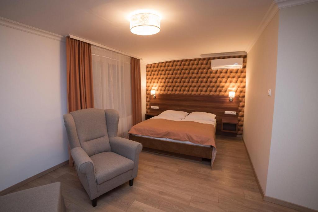 Posteľ alebo postele v izbe v ubytovaní Hotel Alfa