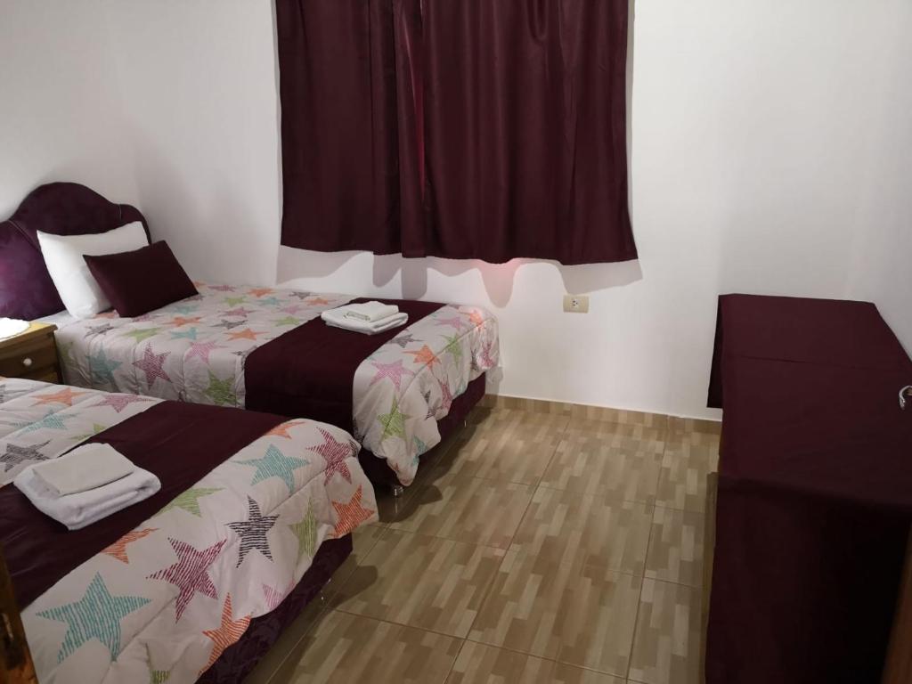 Postel nebo postele na pokoji v ubytování Posada Bavaria