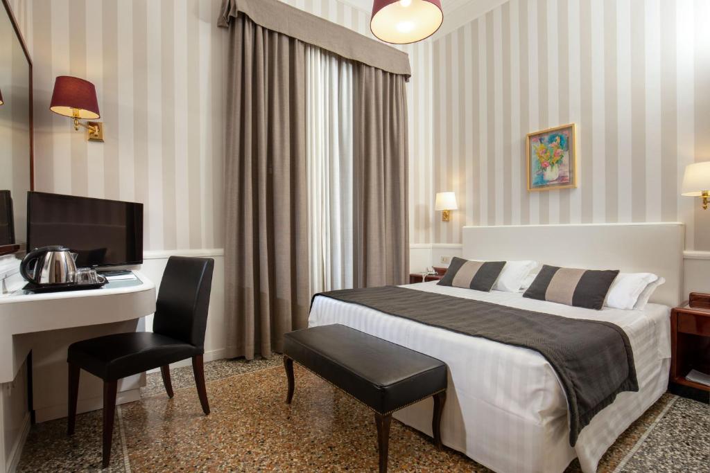 Postel nebo postele na pokoji v ubytování Hotel Nord Nuova Roma