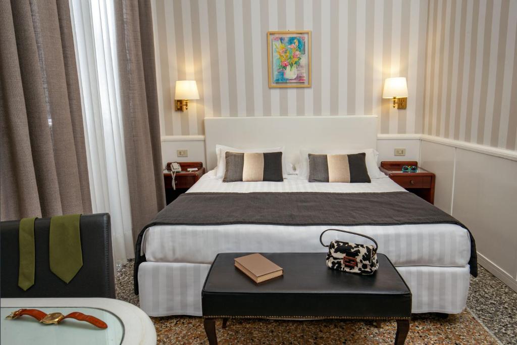 Postel nebo postele na pokoji v ubytování Hotel Nord Nuova Roma