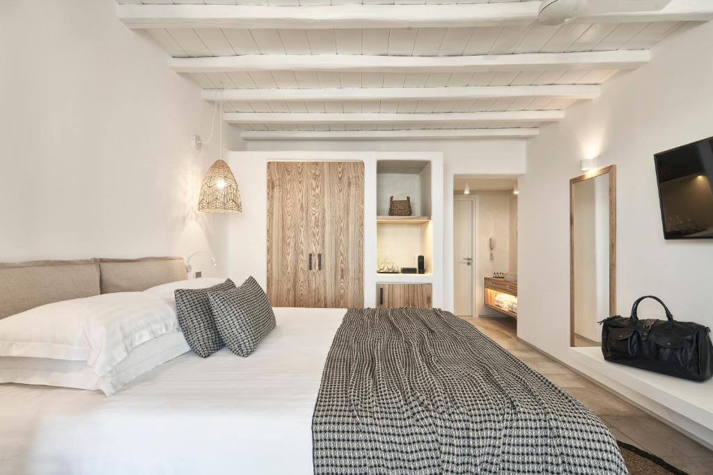 Postel nebo postele na pokoji v ubytování Mykonos Bliss - Cozy Suites, Adults Only Hotel