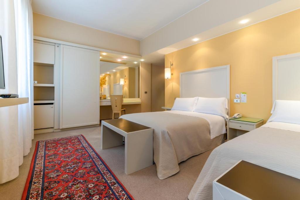 Postel nebo postele na pokoji v ubytování Hotel Globo