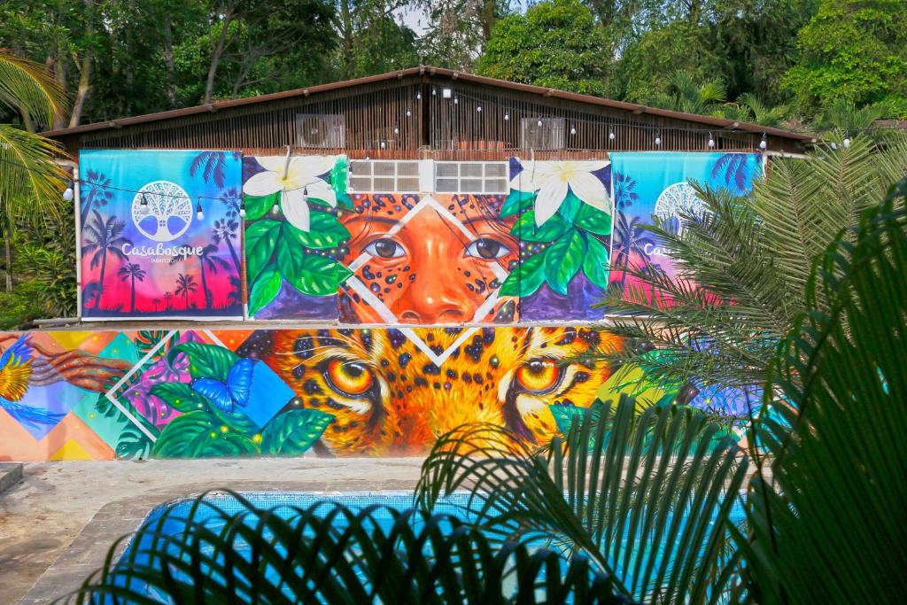 a wall with a colorful mural on it at CasaBosque in Tarapoto