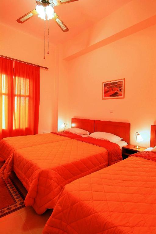 Postel nebo postele na pokoji v ubytování Sibylla Hotel