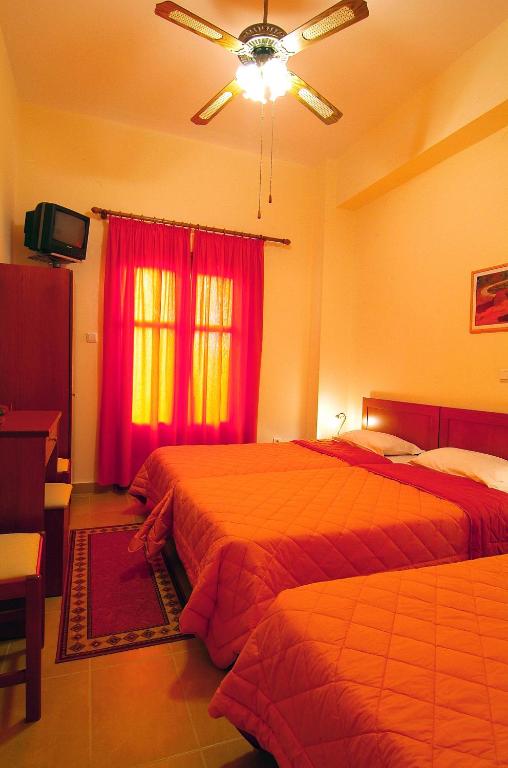 Postel nebo postele na pokoji v ubytování Sibylla Hotel