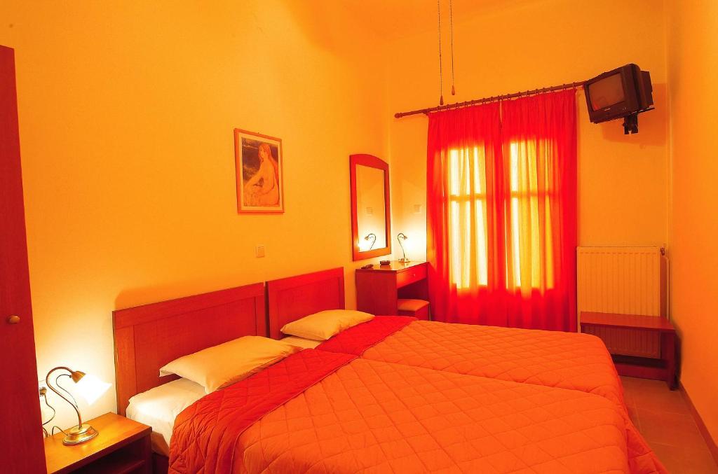 Postel nebo postele na pokoji v ubytování Sibylla Hotel