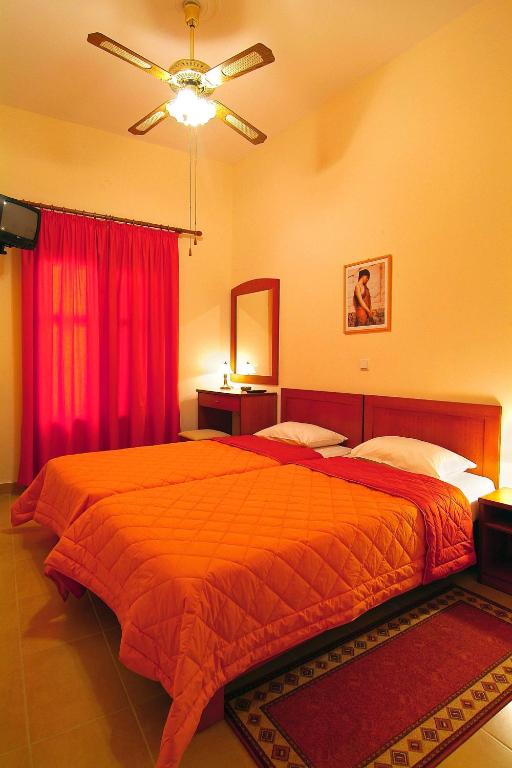 Postel nebo postele na pokoji v ubytování Sibylla Hotel