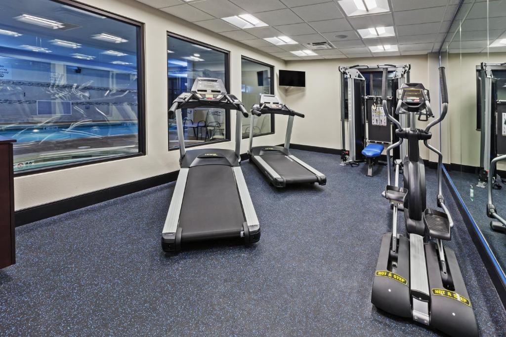a gym with treadmills and elliptical machines at Holiday Inn Express & Suites Glenpool by IHG in Glenpool