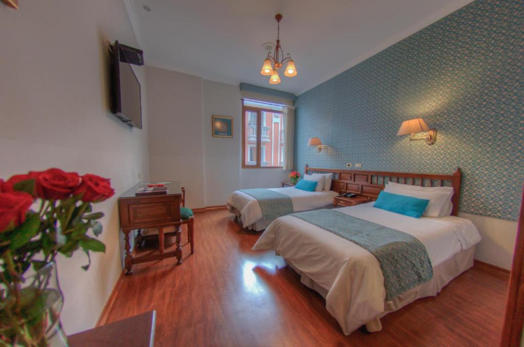 Postel nebo postele na pokoji v ubytování Hotel Real Audiencia