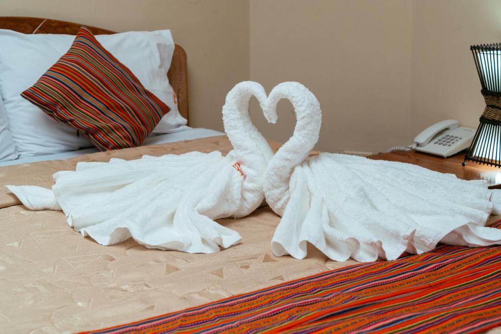 Postel nebo postele na pokoji v ubytování Hotel Melanys