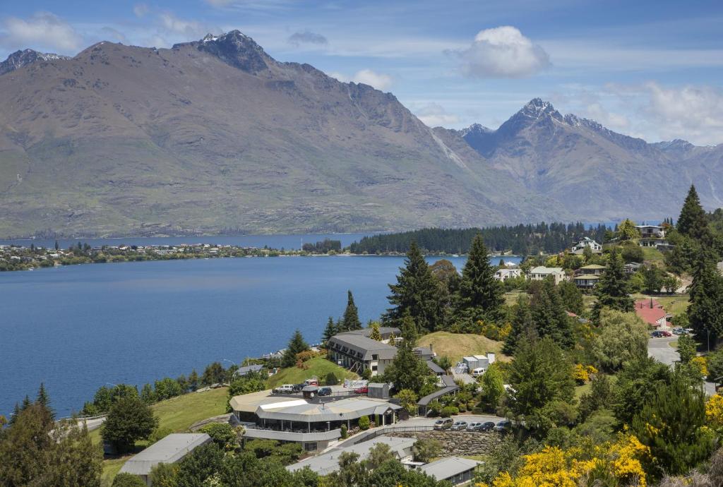 an aerial view of the lake and mountains at Holiday Inn Queenstown Frankton Road, an IHG Hotel in Queenstown
