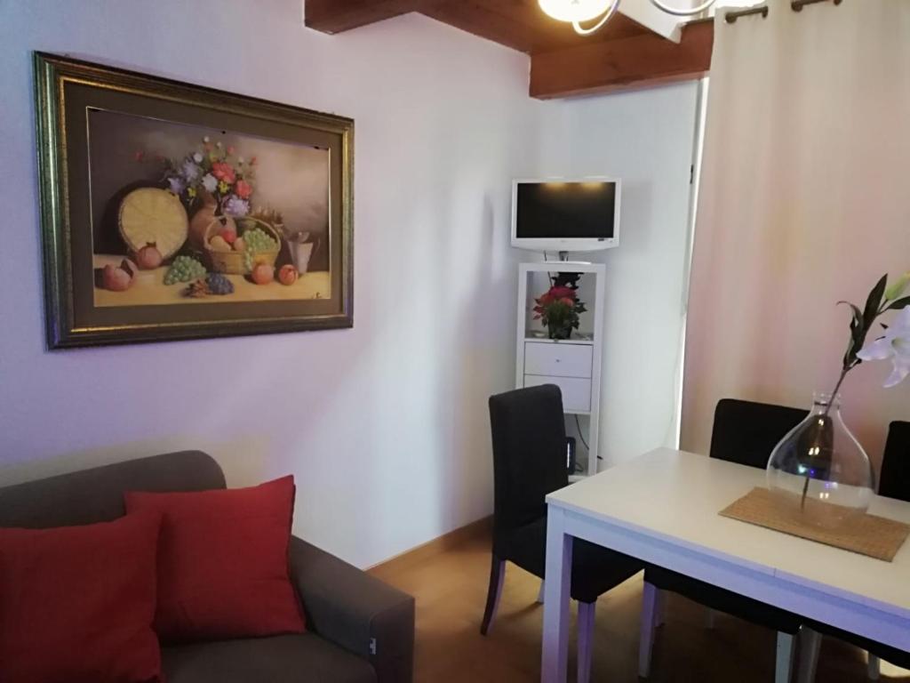 Televízia a/alebo spoločenská miestnosť v ubytovaní Coronari 45 apartment
