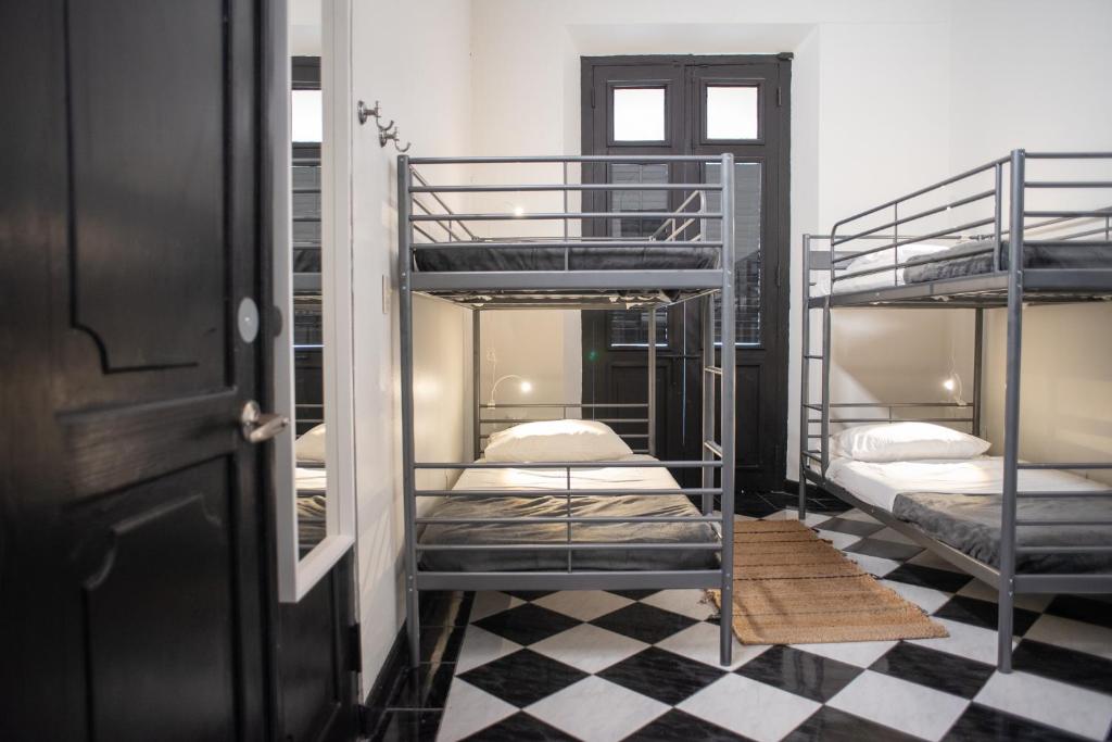 Postel nebo postele na pokoji v ubytování Fortel Hostel