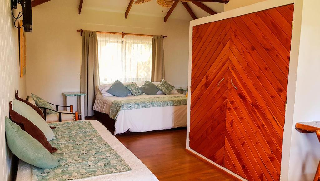 Postel nebo postele na pokoji v ubytování Pikera Uri Eco Lodge