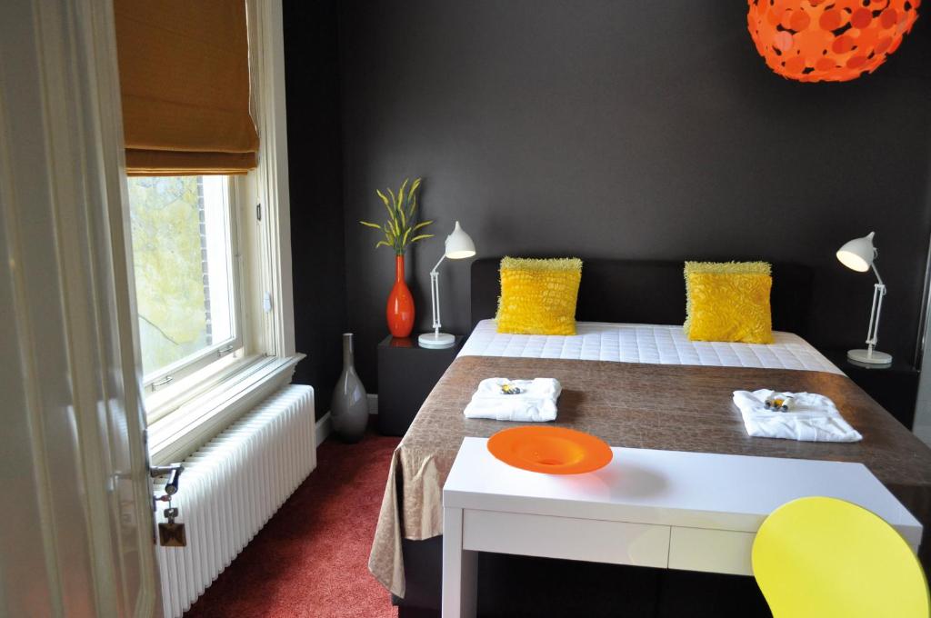 Postel nebo postele na pokoji v ubytování City Hotel Koningsvlinder