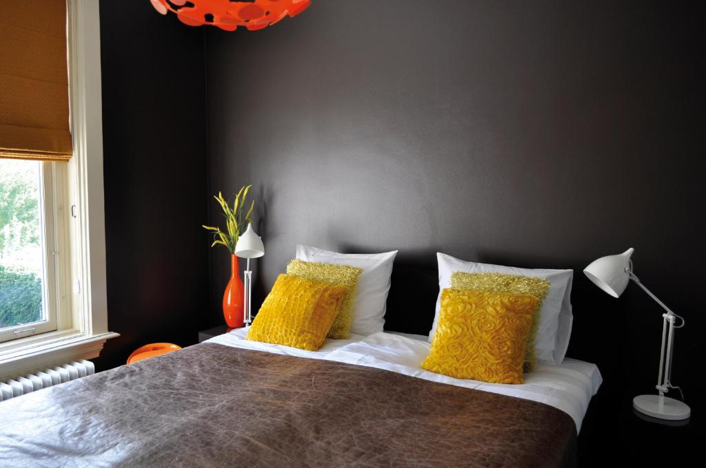 Postel nebo postele na pokoji v ubytování City Hotel Koningsvlinder