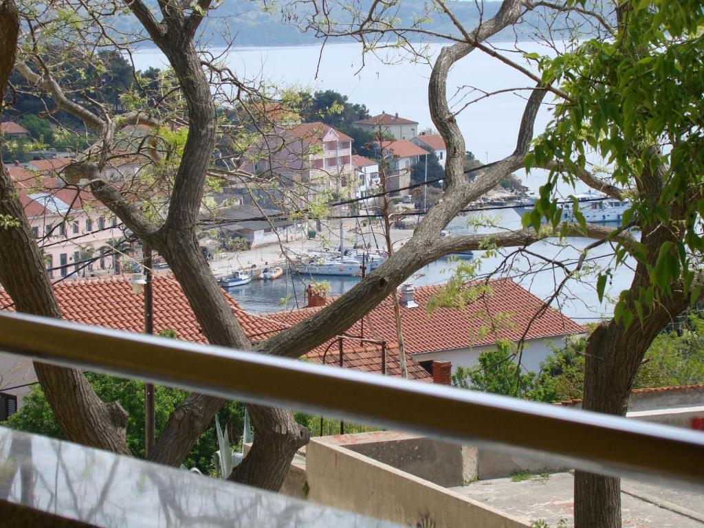 a view of a city from a balcony at Apartments Žana - Ground floor Apartments with sea view in Sali