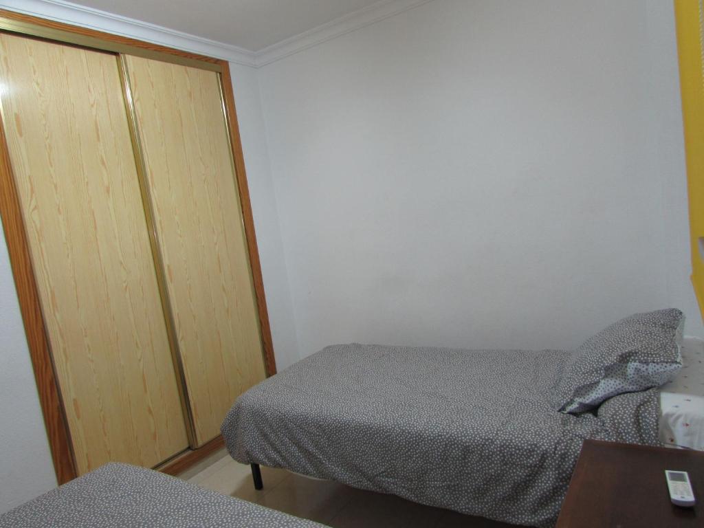Posteľ alebo postele v izbe v ubytovaní Garrucha Apartment