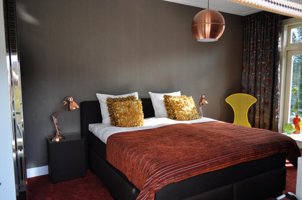 Postel nebo postele na pokoji v ubytování City Hotel Koningsvlinder