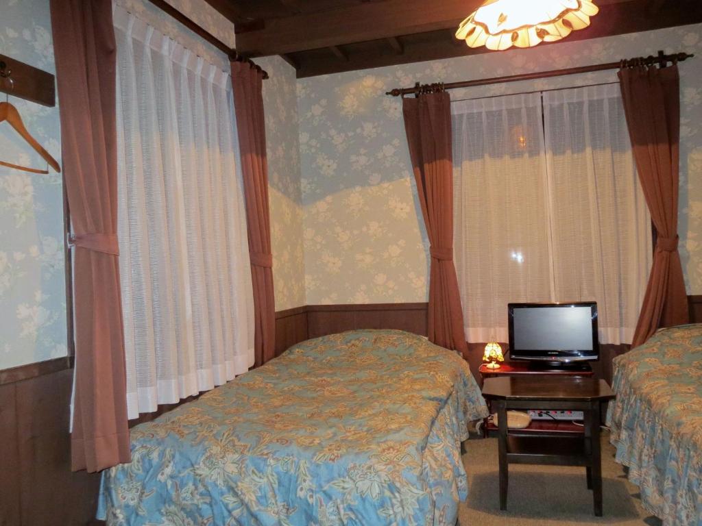 Postel nebo postele na pokoji v ubytování Pension Marionette