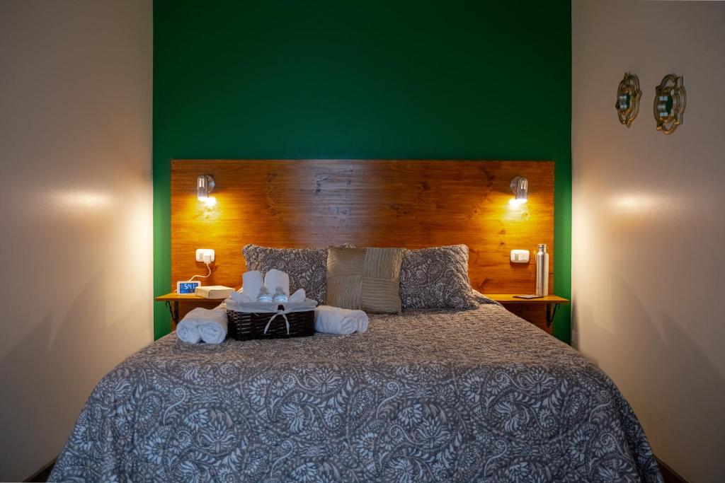 Postel nebo postele na pokoji v ubytování Alice y Juancito Boutique Hotel