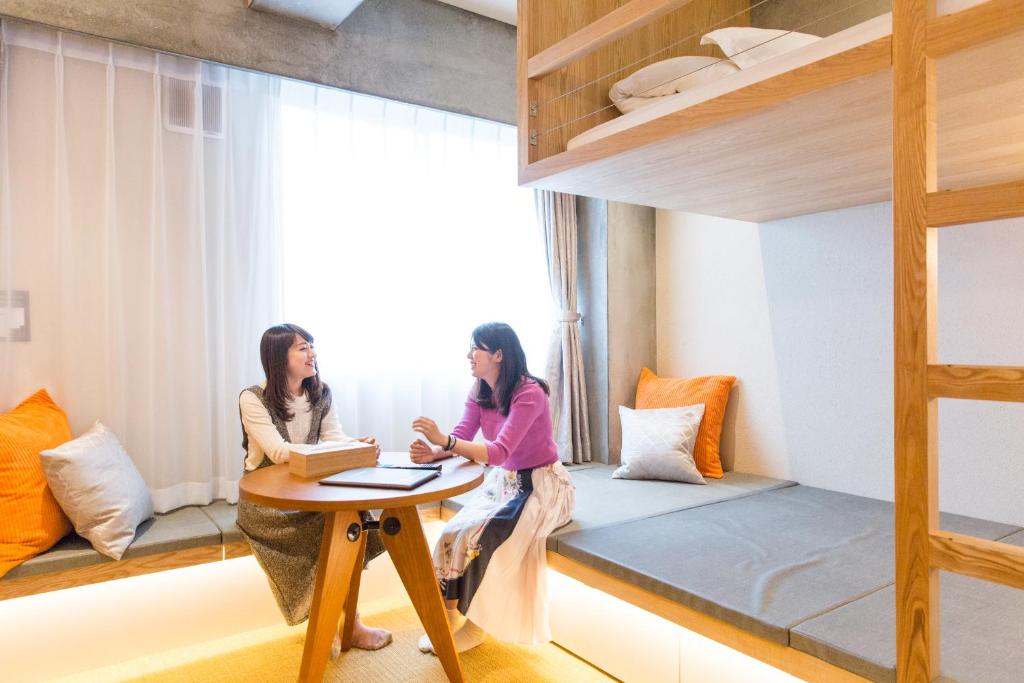 Postel nebo postele na pokoji v ubytování Sakura Cross Hotel Tokyo Kayabacho