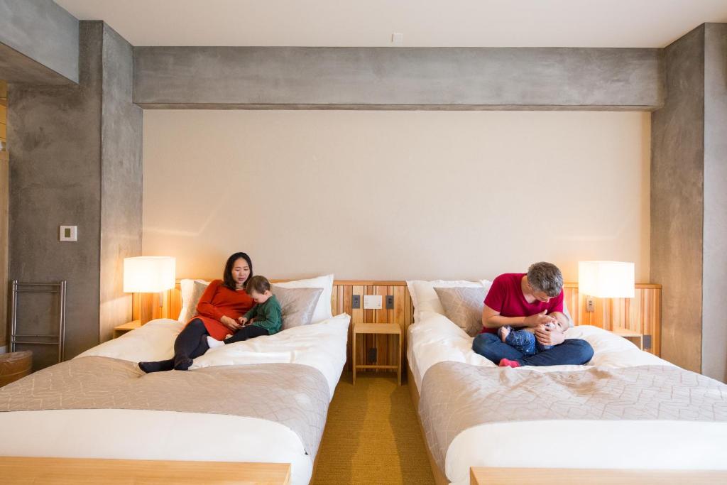 Postel nebo postele na pokoji v ubytování Sakura Cross Hotel Tokyo Kayabacho