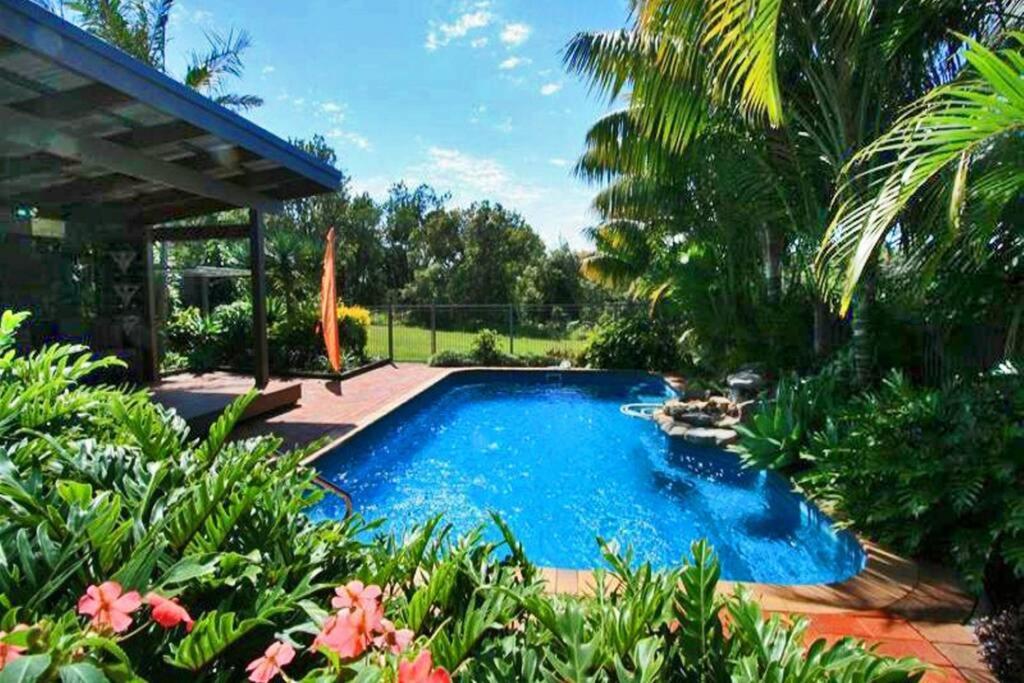 a swimming pool in a yard with plants at Illalangi - views, pool, walk to beach in North Haven