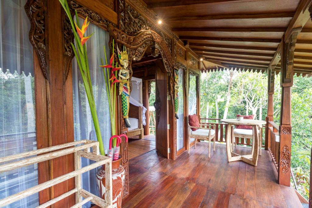 Balkón nebo terasa v ubytování Villa Be Bali Hut Farm Stay