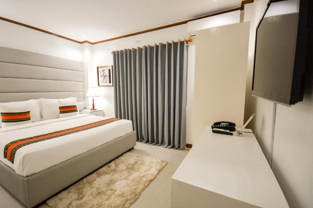 Postel nebo postele na pokoji v ubytování Sur Beach Resort Boracay