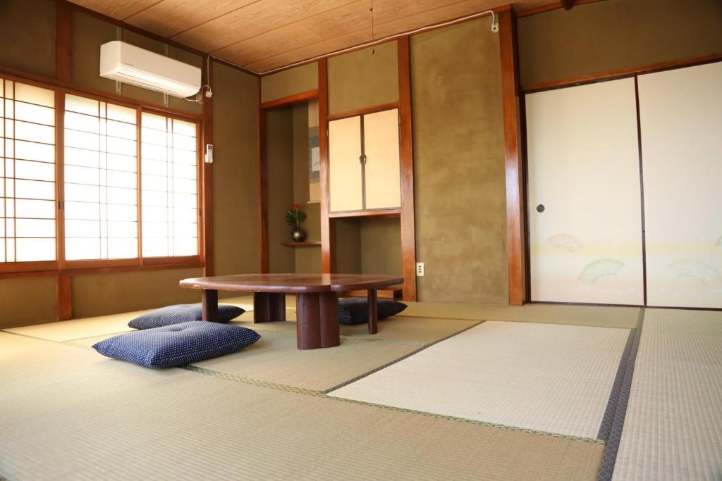 מיטה או מיטות בחדר ב-Guesthouse Nishihara