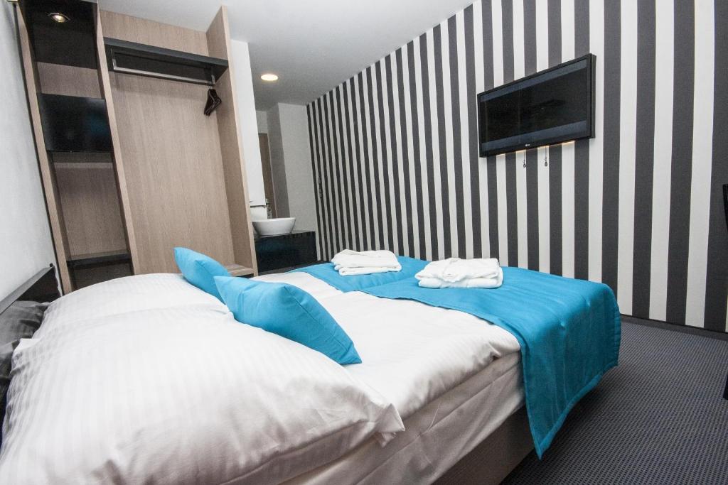 Cama o camas de una habitación en Hotel AquaCity Riverside