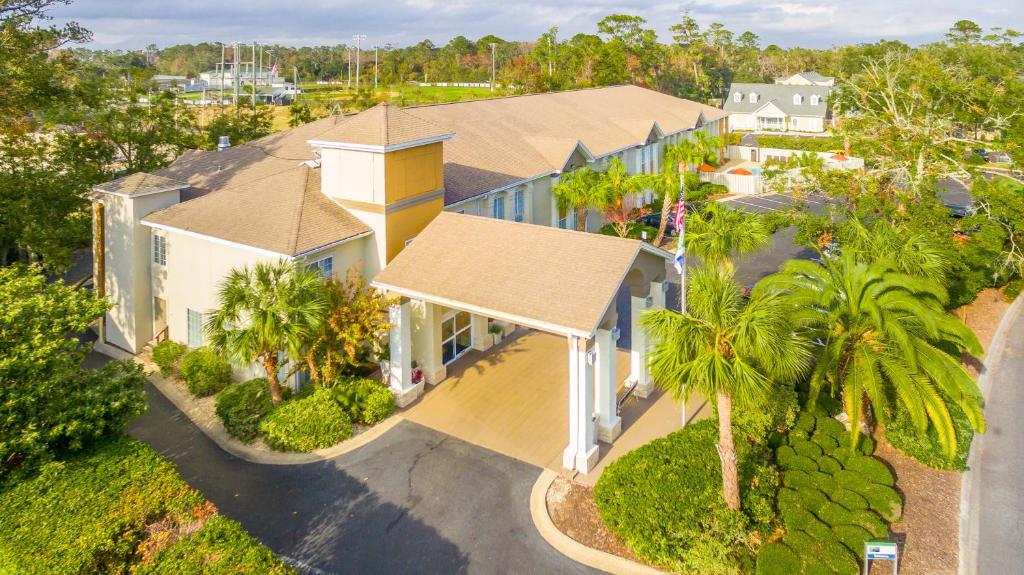 an aerial view of a house with palm trees at Holiday Inn Express Saint Simons Island, an IHG Hotel in Saint Simons Island