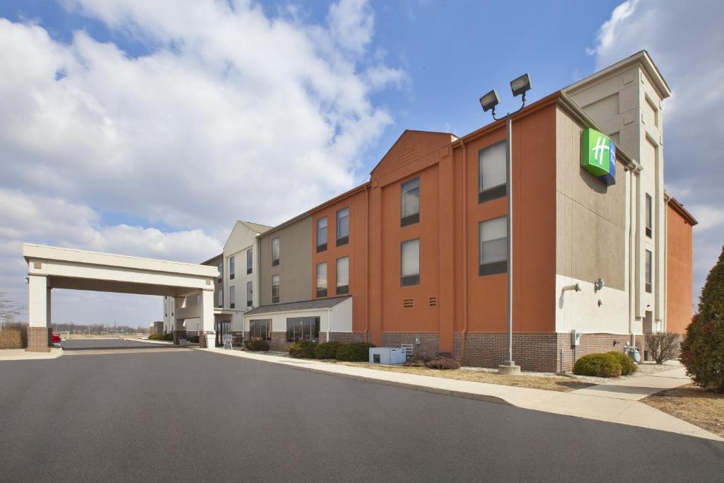 a rendering of a hotel building with a gas station at Holiday Inn Express Tiffin, an IHG Hotel in Tiffin