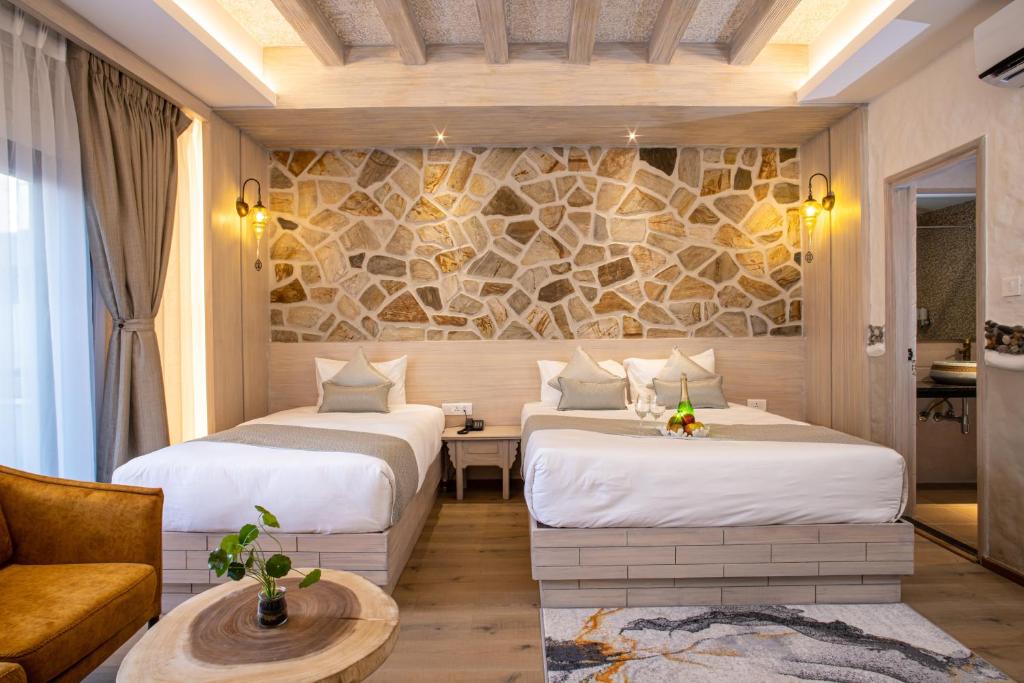 Postel nebo postele na pokoji v ubytování Arushi Boutique Hotel