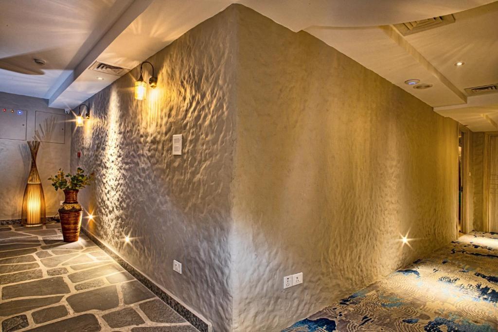 Postel nebo postele na pokoji v ubytování Arushi Boutique Hotel