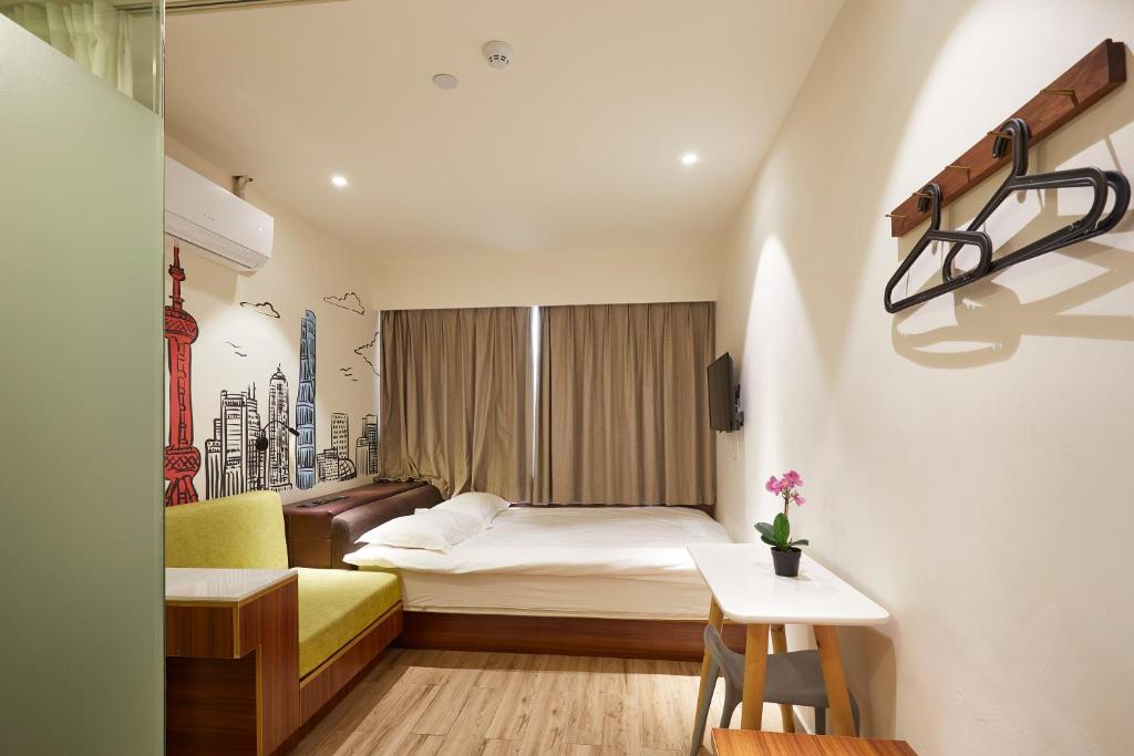 Postel nebo postele na pokoji v ubytování Shanghai Meego Qingwen Hotel