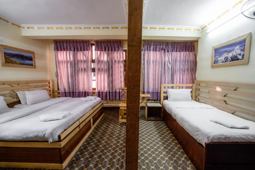 Postel nebo postele na pokoji v ubytování Hotel Pomelo House