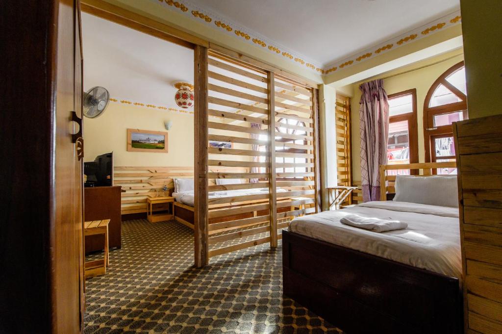 Postel nebo postele na pokoji v ubytování Hotel Pomelo House