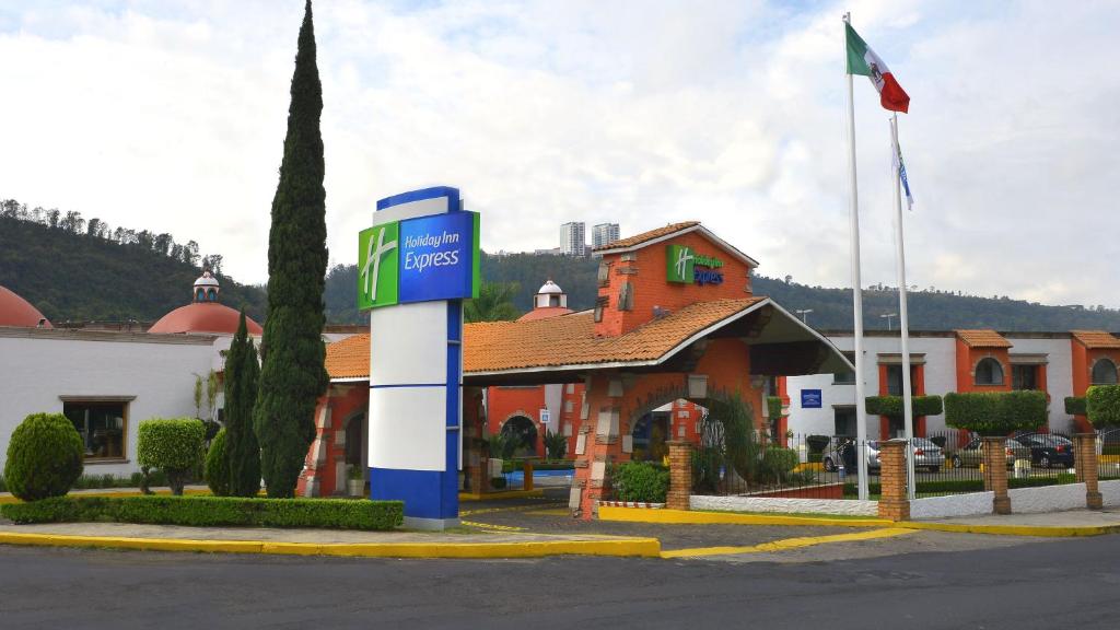 a gas pump in front of a building at Holiday Inn Express Morelia, an IHG Hotel in Morelia