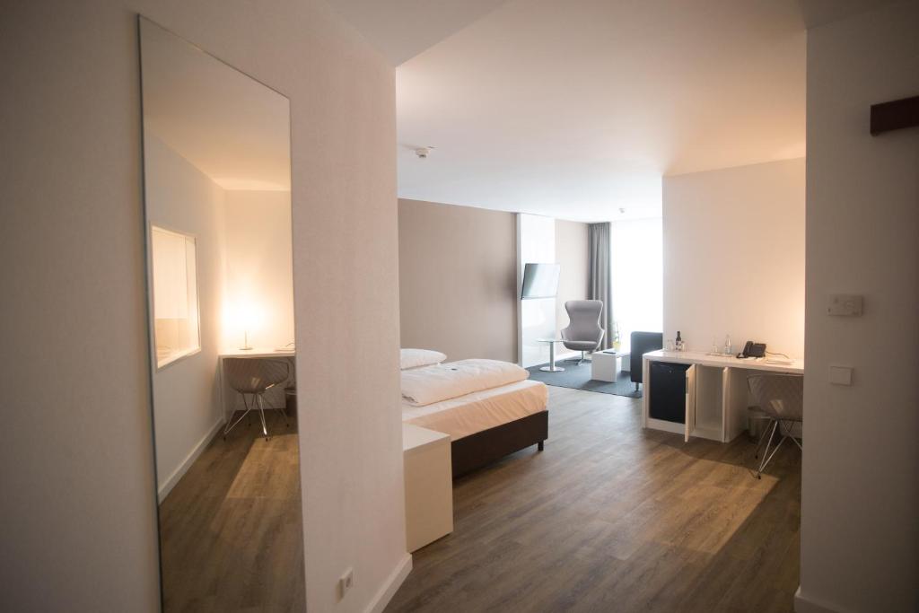 Postel nebo postele na pokoji v ubytování Hotel absolute