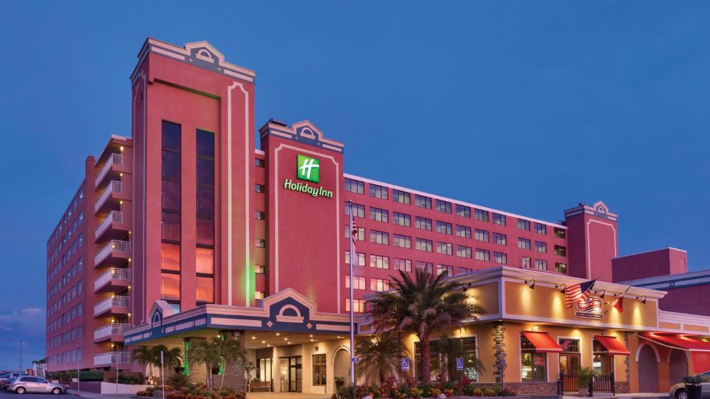 a hotel with a sign on the side of it at Holiday Inn Ocean City, an IHG Hotel in Ocean City