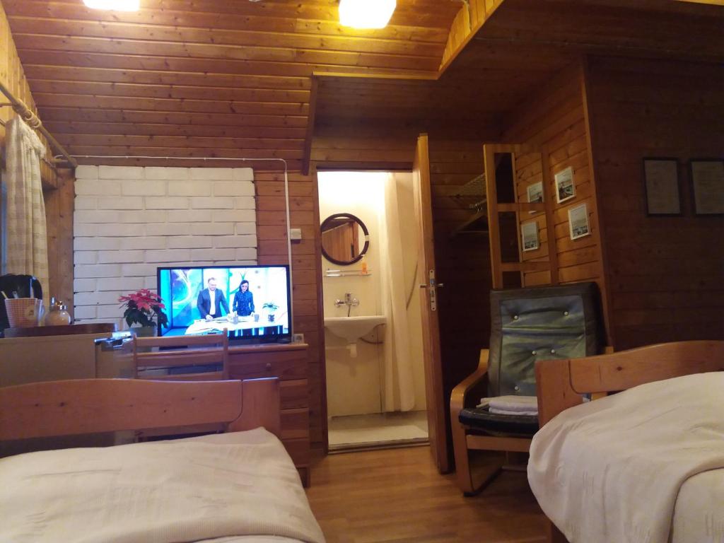 TV a/nebo společenská místnost v ubytování White Villa