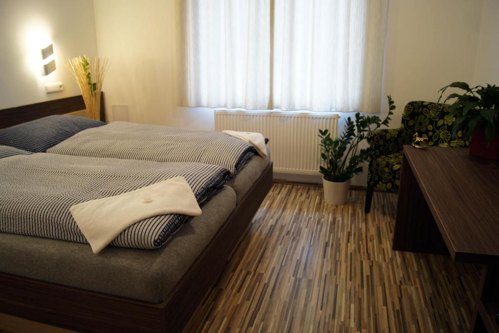 Postel nebo postele na pokoji v ubytování Penzion Ranch