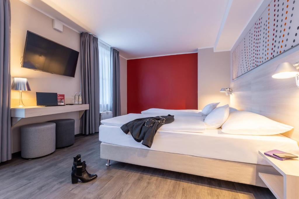 Postel nebo postele na pokoji v ubytování Serways Hotel Reinhardshain Nord