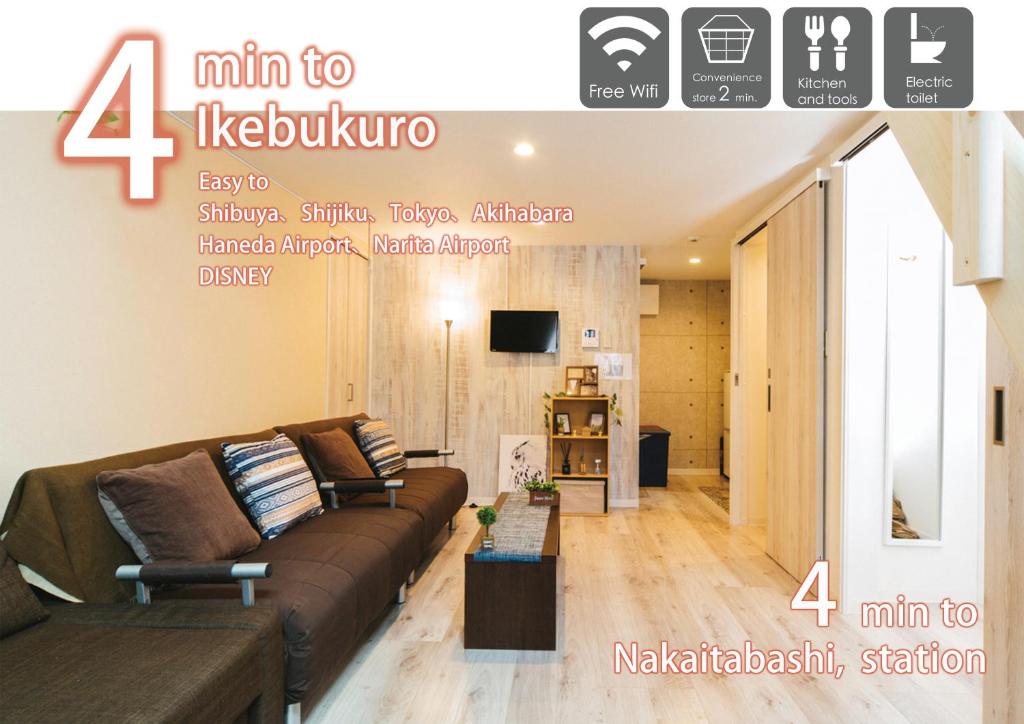 a living room with a couch and a tv at nestay house tokyo itabashi 01 in Tokyo