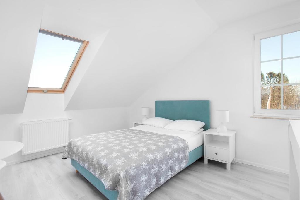 Postel nebo postele na pokoji v ubytování Apartamenty Góra